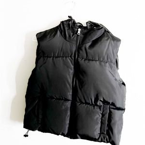 Black Puffer Vest Made by Charlotte Russe in Size Medium.